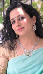 AD stones Pearl dangling necklace with green centre stone