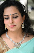 AD stones Pearl dangling necklace with green centre stone