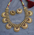 Crescent shaped Ruby colored Necklace