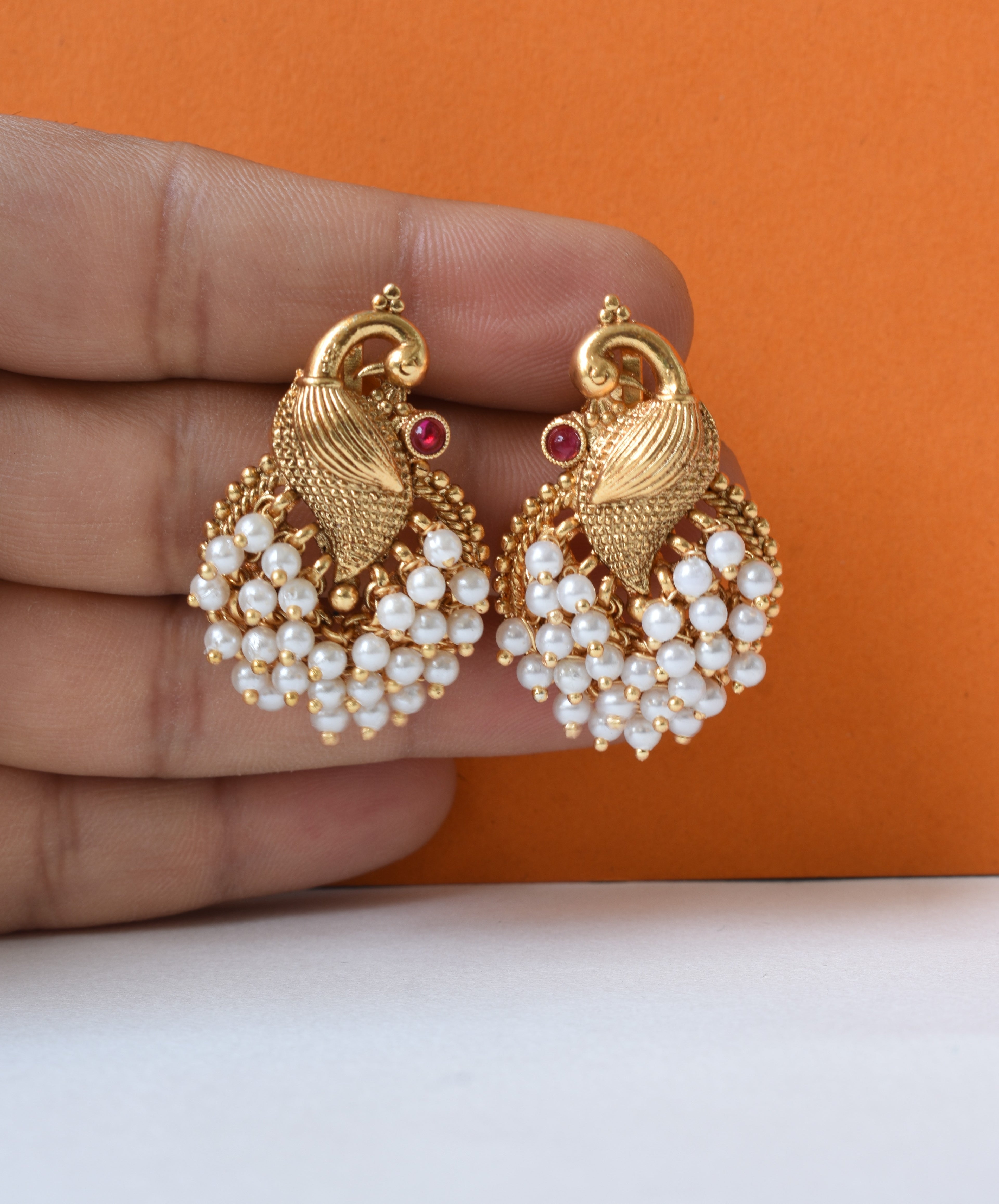 Traditional Peacock Motif Stud Earrings with Pearl Clusters
